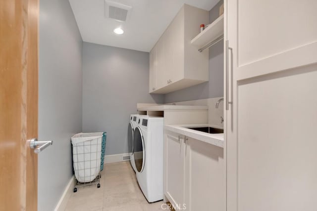 4315 Morro Dr, Woodland Hills, CA 91364 - washroom with washing machine and dryer, cabinet space, baseboards, and light tile patterned floors