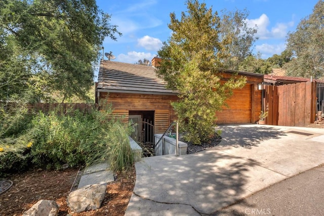 4315 Morro Dr, Woodland Hills, CA 91364 - view of front of home featuring concrete driveway, an attached garage, and a tile roof