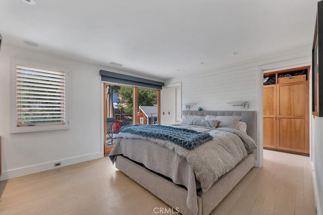 4315 Morro Dr, Woodland Hills, CA 91364 - bedroom featuring access to exterior, light wood-type flooring, and baseboards