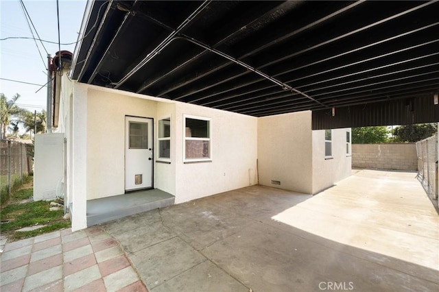 709 E 9th St, Pomona, CA 91766 - fenced backyard featuring a patio and a carport