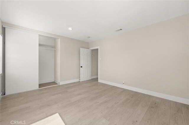 709 E 9th St, Pomona, CA 91766 - unfurnished bedroom featuring baseboards, light wood-style flooring, a closet, and recessed lighting