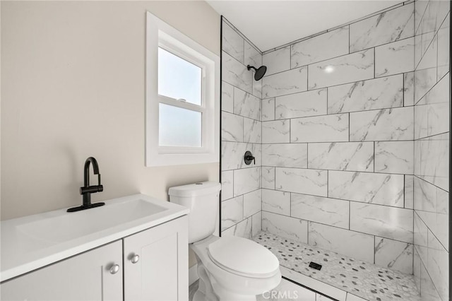 709 E 9th St, Pomona, CA 91766 - full bath with a tile shower, toilet, and vanity