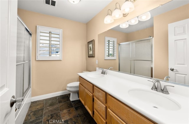 12719 E Rancho Estates Pl, Rancho Cucamonga, CA 91739 - full bath with baseboards, double vanity, toilet, and stone finish floors