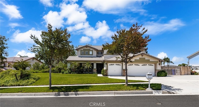 12719 E Rancho Estates Pl, Rancho Cucamonga, CA 91739 - view of front of house with a garage, concrete driveway, a front lawn, a tiled roof, and stucco siding
