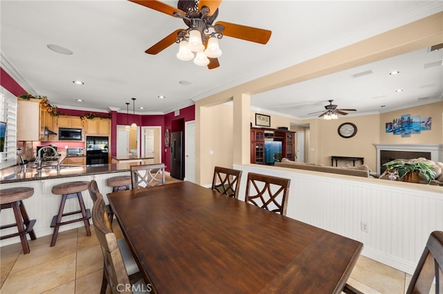 12719 E Rancho Estates Pl, Rancho Cucamonga, CA 91739 - dining area featuring a ceiling fan, crown molding, light tile patterned flooring, recessed lighting, and wainscoting