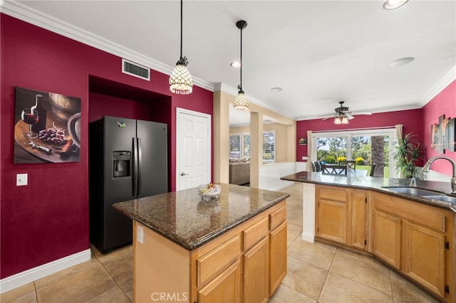 12719 E Rancho Estates Pl, Rancho Cucamonga, CA 91739 - kitchen featuring black fridge with ice dispenser, a sink, crown molding, light tile patterned floors, and a kitchen island