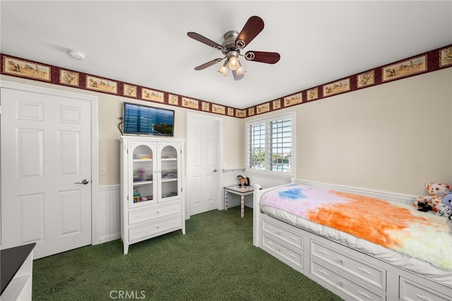 12719 E Rancho Estates Pl, Rancho Cucamonga, CA 91739 - bedroom with a wainscoted wall, dark carpet, and a ceiling fan