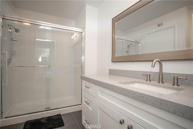 54229 Oakhill Ln, Quinta, CA 92253 - bathroom featuring vanity, a stall shower, and tile patterned floors