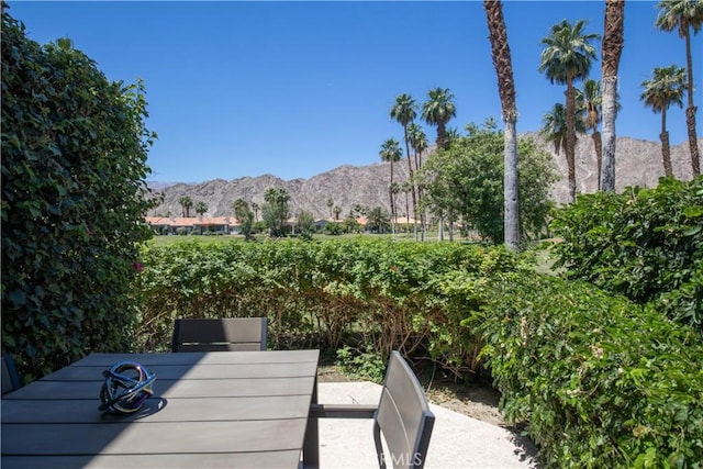 54229 Oakhill Ln, Quinta, CA 92253 - wooden deck featuring a mountain view and outdoor dining space
