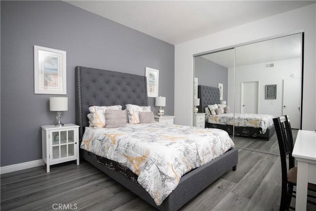 54229 Oakhill Ln, Quinta, CA 92253 - bedroom featuring wood finished floors, a closet, and baseboards
