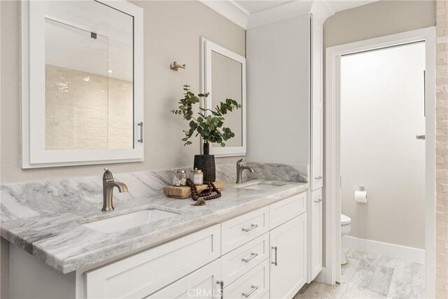 20402 Seven Seas Ln, Huntington Beach, CA 92646 - bathroom featuring toilet and double vanity