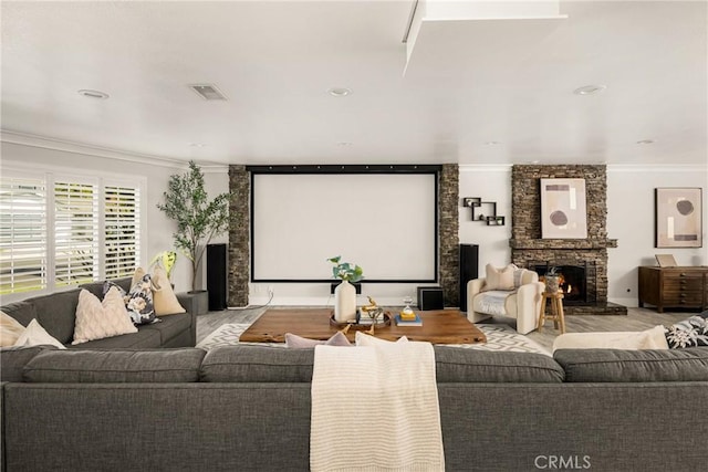 20402 Seven Seas Ln, Huntington Beach, CA 92646 - home theater room featuring ornamental molding and a stone fireplace