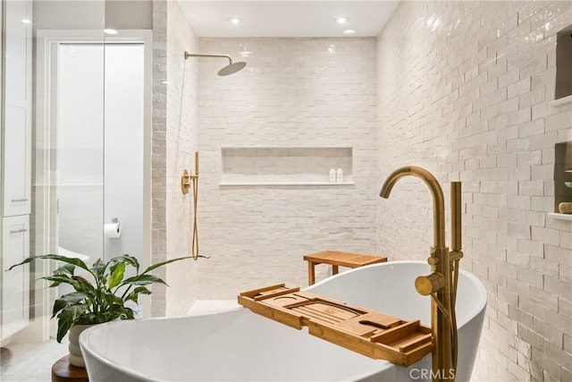 20402 Seven Seas Ln, Huntington Beach, CA 92646 - bathroom featuring a soaking tub, a tile shower, and recessed lighting