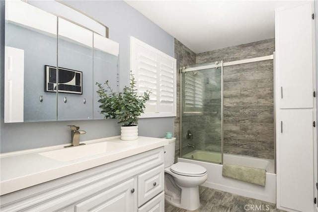 20402 Seven Seas Ln, Huntington Beach, CA 92646 - full bathroom with vanity, wood finished floors, and combined bath / shower with glass door