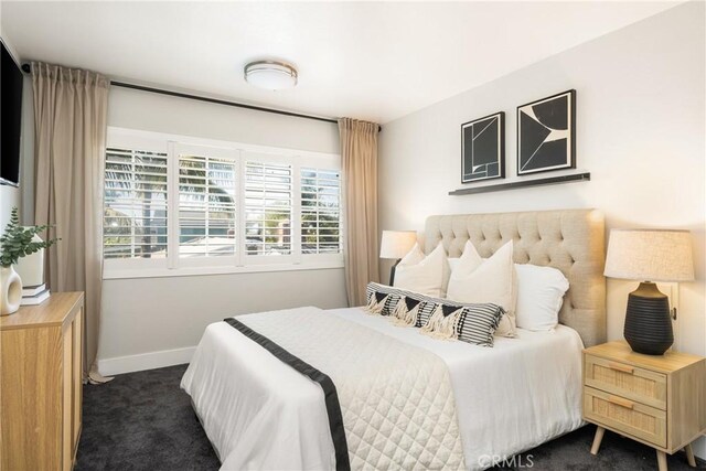 20402 Seven Seas Ln, Huntington Beach, CA 92646 - bedroom featuring dark colored carpet and baseboards