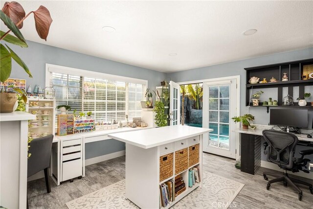 20402 Seven Seas Ln, Huntington Beach, CA 92646 - home office with light wood-style flooring and baseboards