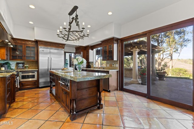 13045 Ripple Creek Ln, Camarillo, CA 93012 - kitchen featuring stainless steel appliances, backsplash, a warming drawer, plenty of natural light, and recessed lighting