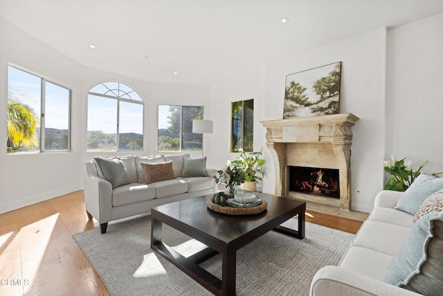13045 Ripple Creek Ln, Camarillo, CA 93012 - living area with a premium fireplace, light wood-style flooring, baseboards, and recessed lighting