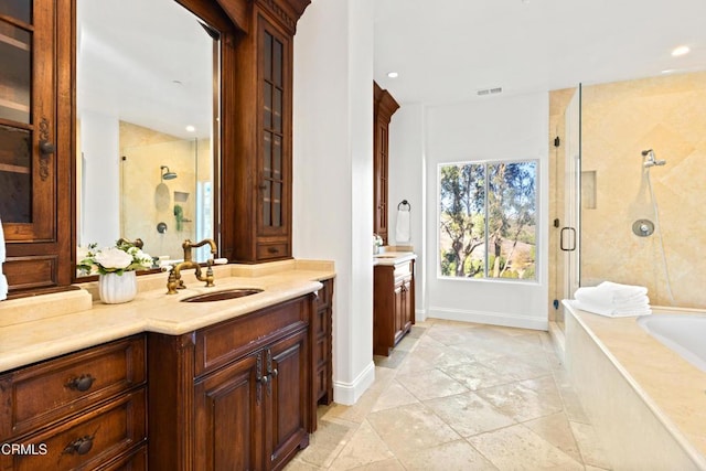 13045 Ripple Creek Ln, Camarillo, CA 93012 - full bath featuring vanity, a shower stall, a bath, recessed lighting, and baseboards