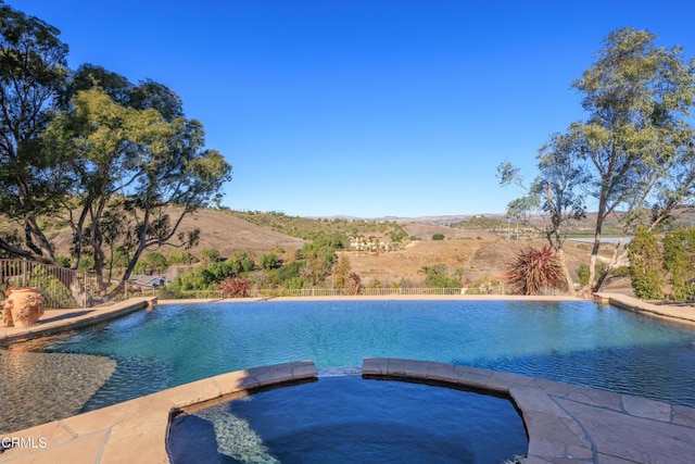 13045 Ripple Creek Ln, Camarillo, CA 93012 - view of swimming pool with a pool with connected hot tub and a mountain view