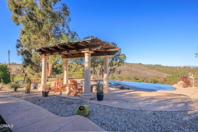 13045 Ripple Creek Ln, Camarillo, CA 93012 - view of patio / terrace featuring a pergola and a mountain view