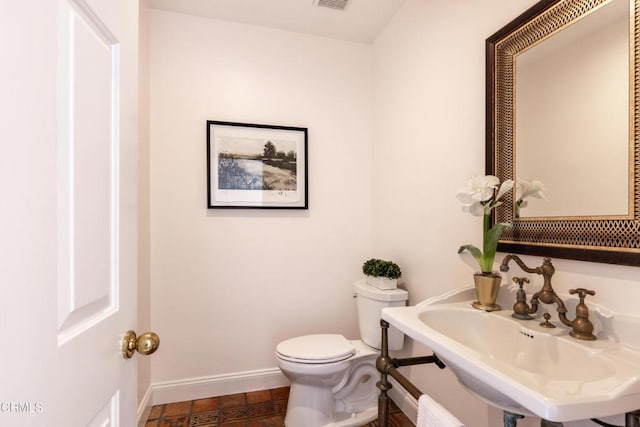13045 Ripple Creek Ln, Camarillo, CA 93012 - bathroom with toilet, baseboards, and a sink