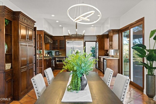 13045 Ripple Creek Ln, Camarillo, CA 93012 - dining area with a chandelier, light tile patterned flooring, and recessed lighting