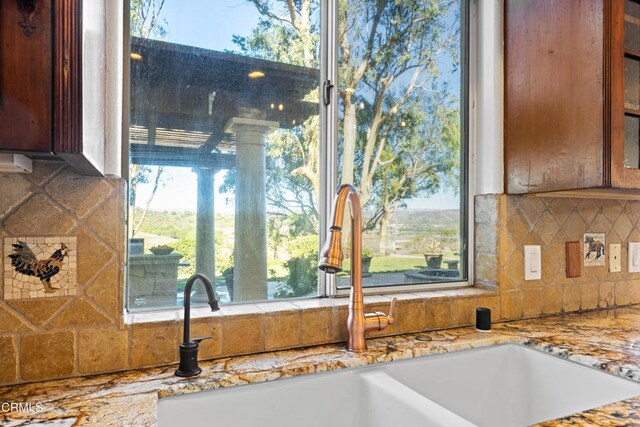 13045 Ripple Creek Ln, Camarillo, CA 93012 - kitchen view of decorative backsplash, glass insert cabinets, and light stone countertops