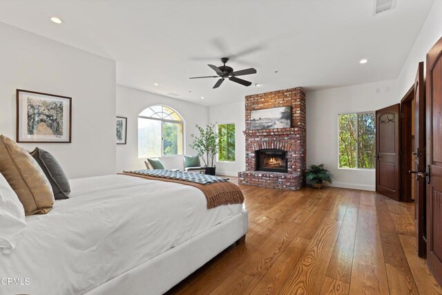 13045 Ripple Creek Ln, Camarillo, CA 93012 - bedroom with hardwood / wood-style flooring, a fireplace, recessed lighting, and ceiling fan