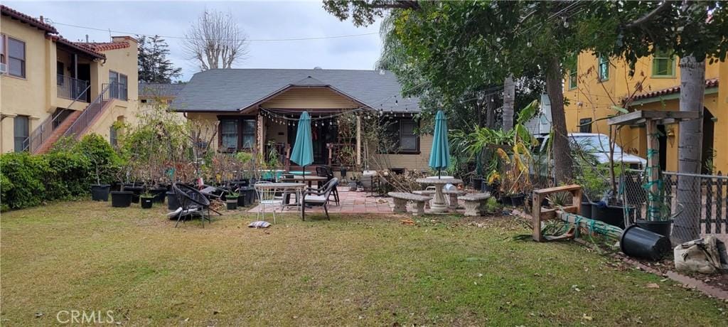 919 N Lacy St, Santa Ana, CA 92701 - rear view of property with a yard