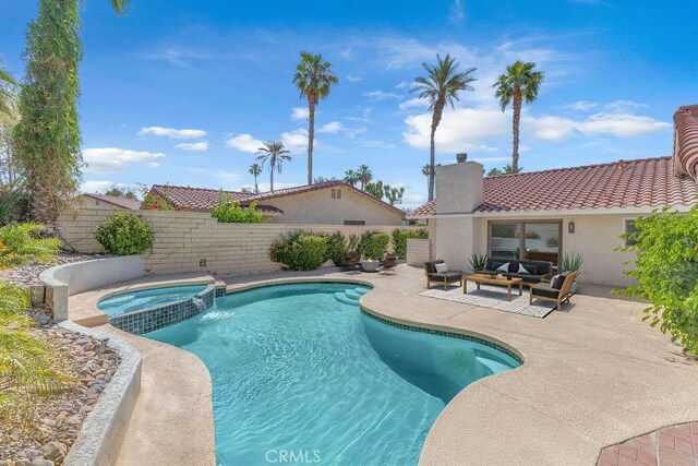 40033 Sagewood Dr, Palm Desert, CA 92260 - view of pool with an outdoor hangout area, a patio, a fenced backyard, and a pool with connected hot tub