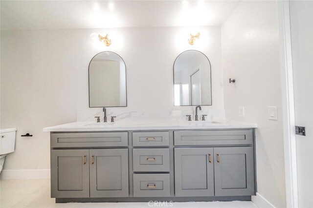 40033 Sagewood Dr, Palm Desert, CA 92260 - full bath with baseboards, double vanity, and toilet