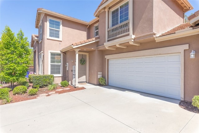 29290 Morena Villa Dr, Highland, CA 92346 - multi unit property with stucco siding, concrete driveway, a garage, and a tiled roof