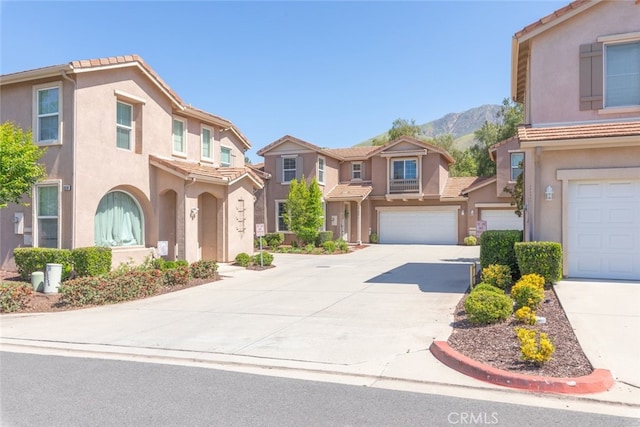 29290 Morena Villa Dr, Highland, CA 92346 - multi unit property featuring driveway, stucco siding, a tiled roof, a mountain view, and a residential view