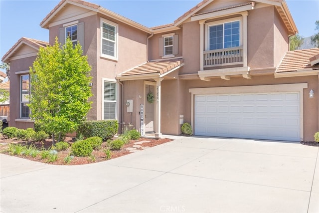 29290 Morena Villa Dr, Highland, CA 92346 - view of front of home with a tile roof, an attached garage, and stucco siding