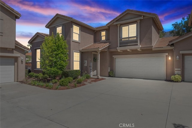 29290 Morena Villa Dr, Highland, CA 92346 - townhome / multi-family property with a tiled roof, driveway, and stucco siding