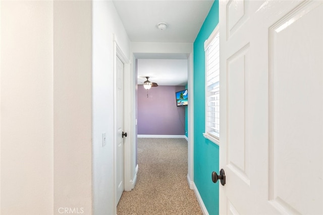 29290 Morena Villa Dr, Highland, CA 92346 - hallway with baseboards, carpet floors, and plenty of natural light