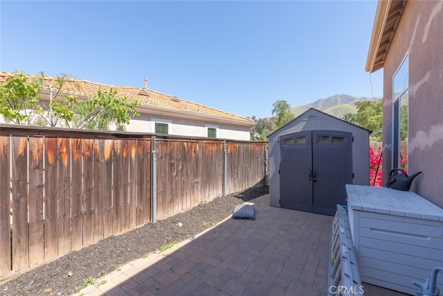 29290 Morena Villa Dr, Highland, CA 92346 - fenced backyard featuring a patio and a mountain view