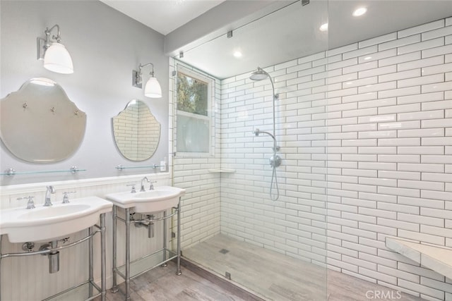 29290 Morena Villa Dr, Highland, CA 92346 - bathroom with walk in shower, a sink, wood finished floors, and recessed lighting