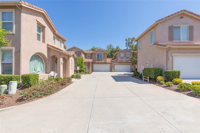 29290 Morena Villa Dr, Highland, CA 92346 - view of concrete driveway with a residential view