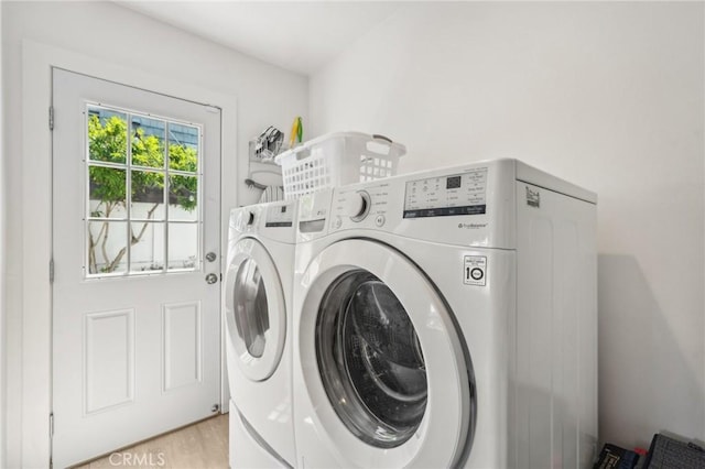 1120 9th St, Hermosa Beach, CA 90254 - laundry area featuring washing machine and dryer and light wood-type flooring