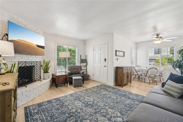 1120 9th St, Hermosa Beach, CA 90254 - living room with a fireplace, wood finished floors, and a ceiling fan