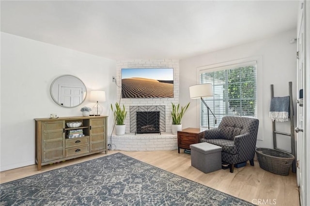 1120 9th St, Hermosa Beach, CA 90254 - living area with wood finished floors and a brick fireplace