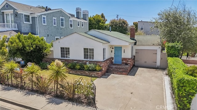1120 9th St, Hermosa Beach, CA 90254 - view of front of property featuring a chimney, a garage, driveway, and stucco siding