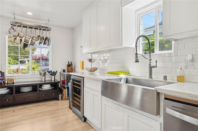 1120 9th St, Hermosa Beach, CA 90254 - kitchen with a sink, beverage cooler, dishwasher, white cabinets, and recessed lighting