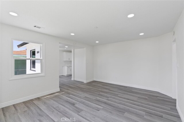 764 N Meridian Ave, Rialto, CA 92376 - spare room with wood finished floors, recessed lighting, and baseboards
