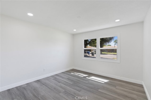 764 N Meridian Ave, Rialto, CA 92376 - spare room with wood finished floors, recessed lighting, and baseboards
