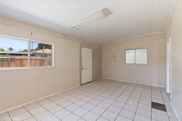 764 N Meridian Ave, Rialto, CA 92376 - spare room featuring lofted ceiling and light tile patterned flooring