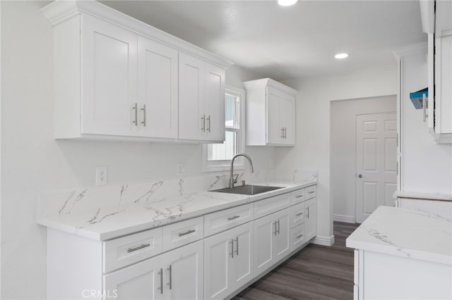 764 N Meridian Ave, Rialto, CA 92376 - kitchen with a sink, white cabinets, dark wood finished floors, recessed lighting, and light stone counters