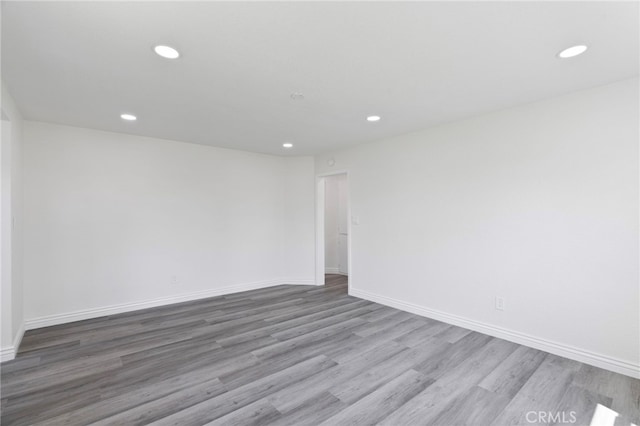 764 N Meridian Ave, Rialto, CA 92376 - spare room with recessed lighting, wood finished floors, and baseboards